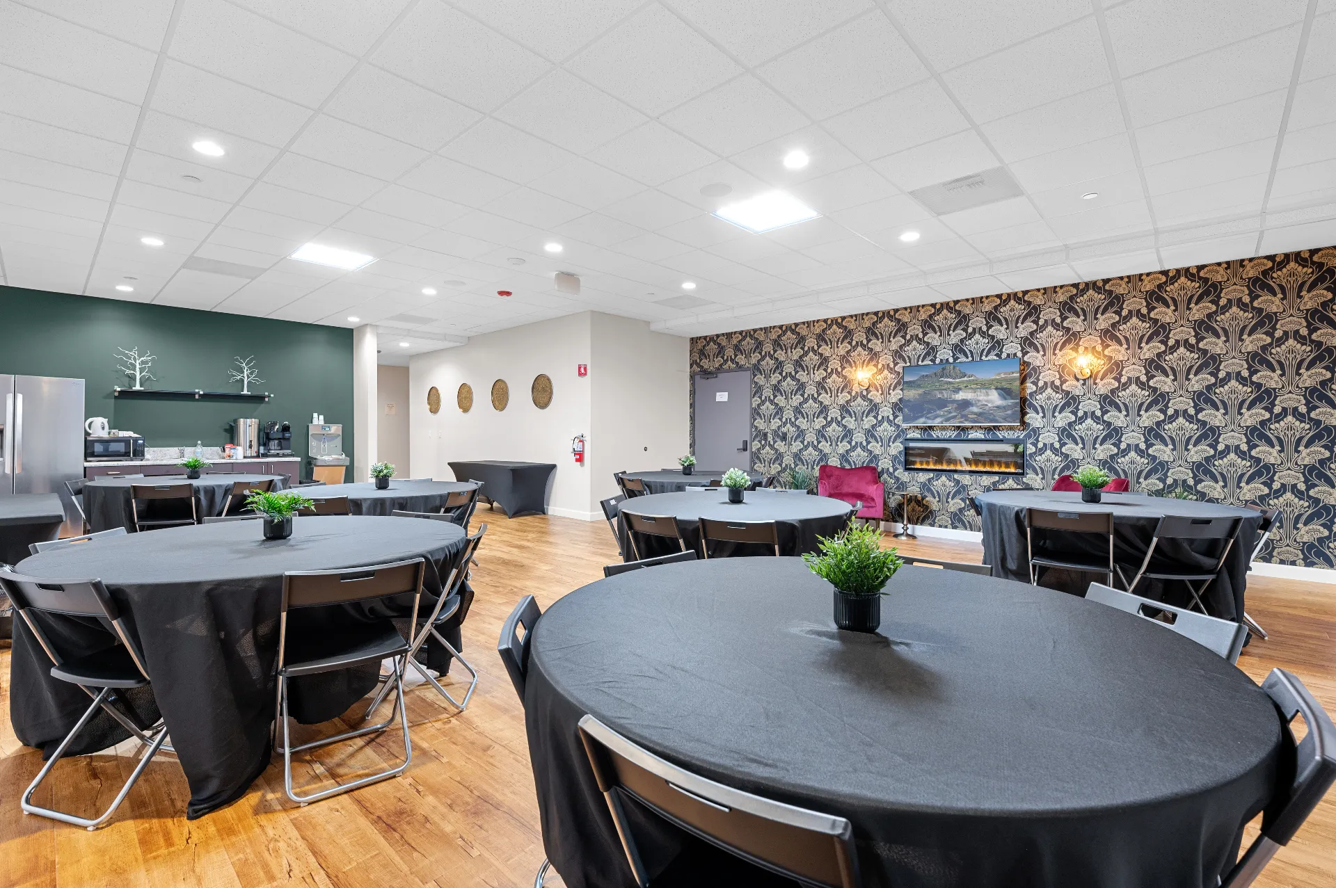 The elegant banquet and reception room at Bravo Family Mortuary with fireplace